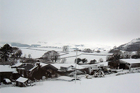 The family farm in the Dales – winter, with Ingleborough in the background.